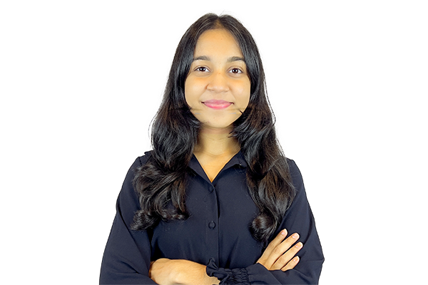 Young woman with long dark hair, wearing a black button-up shirt, arms crossed and smiling at the camera.